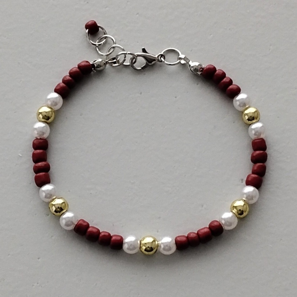 Bracelet with brown, white and gold beads
