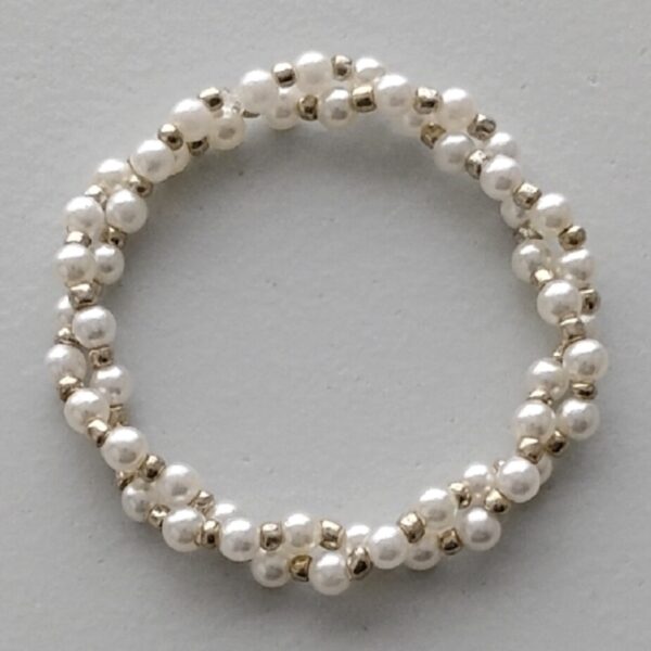 Cross bracelet with cream and silver pearls
