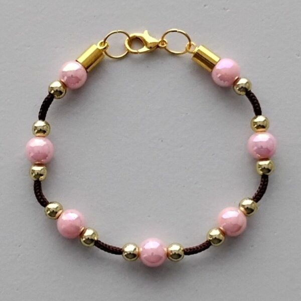 Rope bracelet with pink and gold pearls