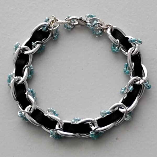Silver chain and faux leather bracelet
